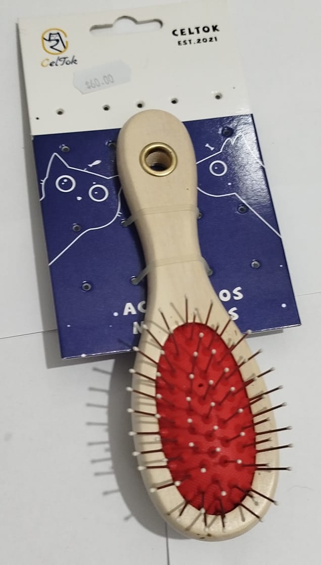 Cepillo para perro de pelo largo de doble cerda.