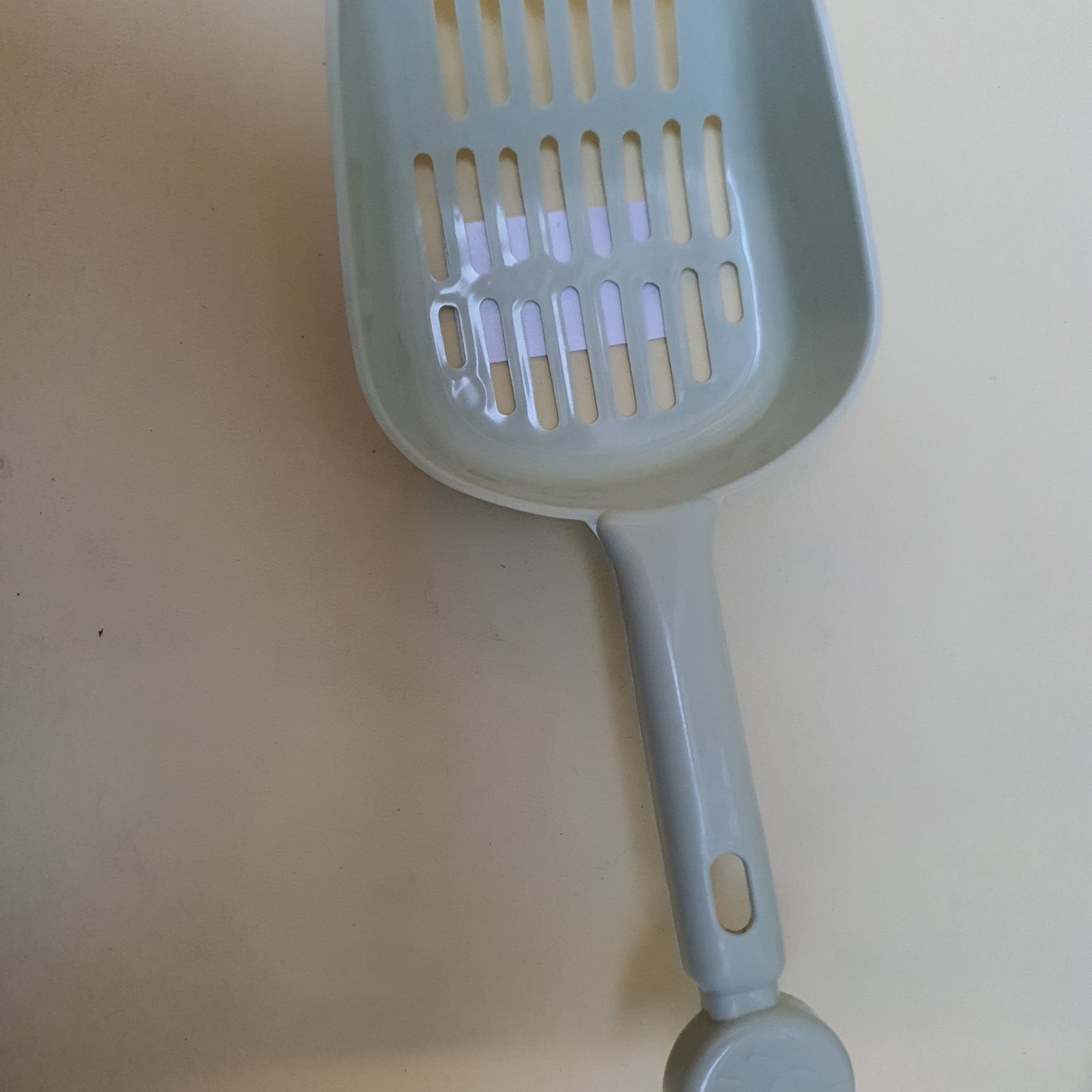 Pala para arena de gato