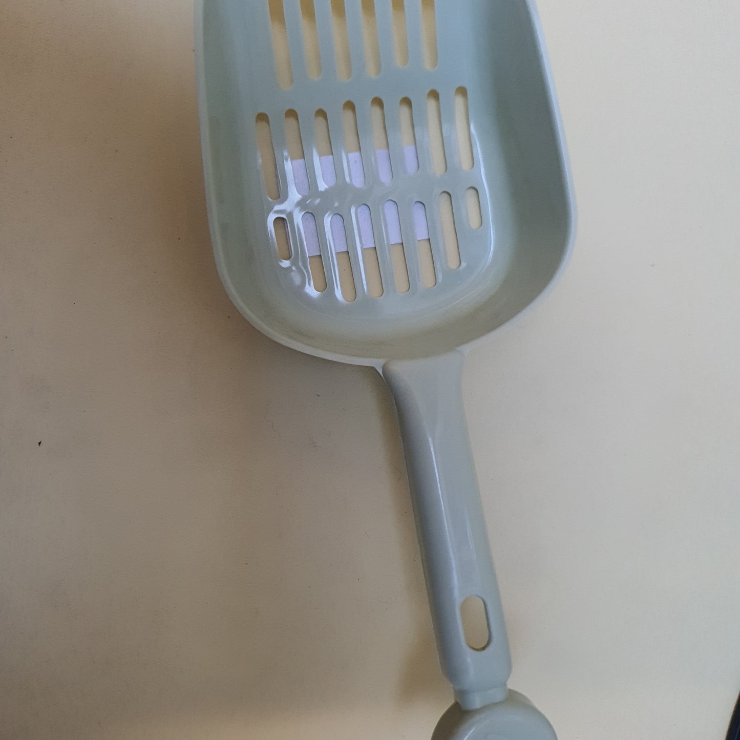 Pala para arena de gato