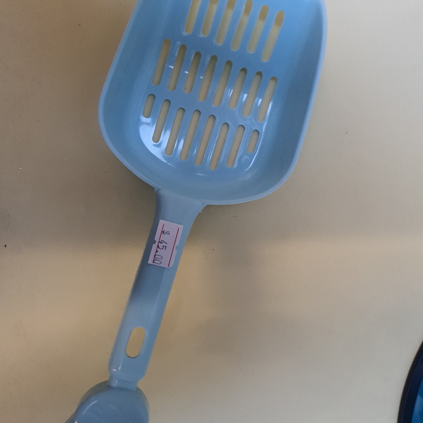 Pala para arena de gato