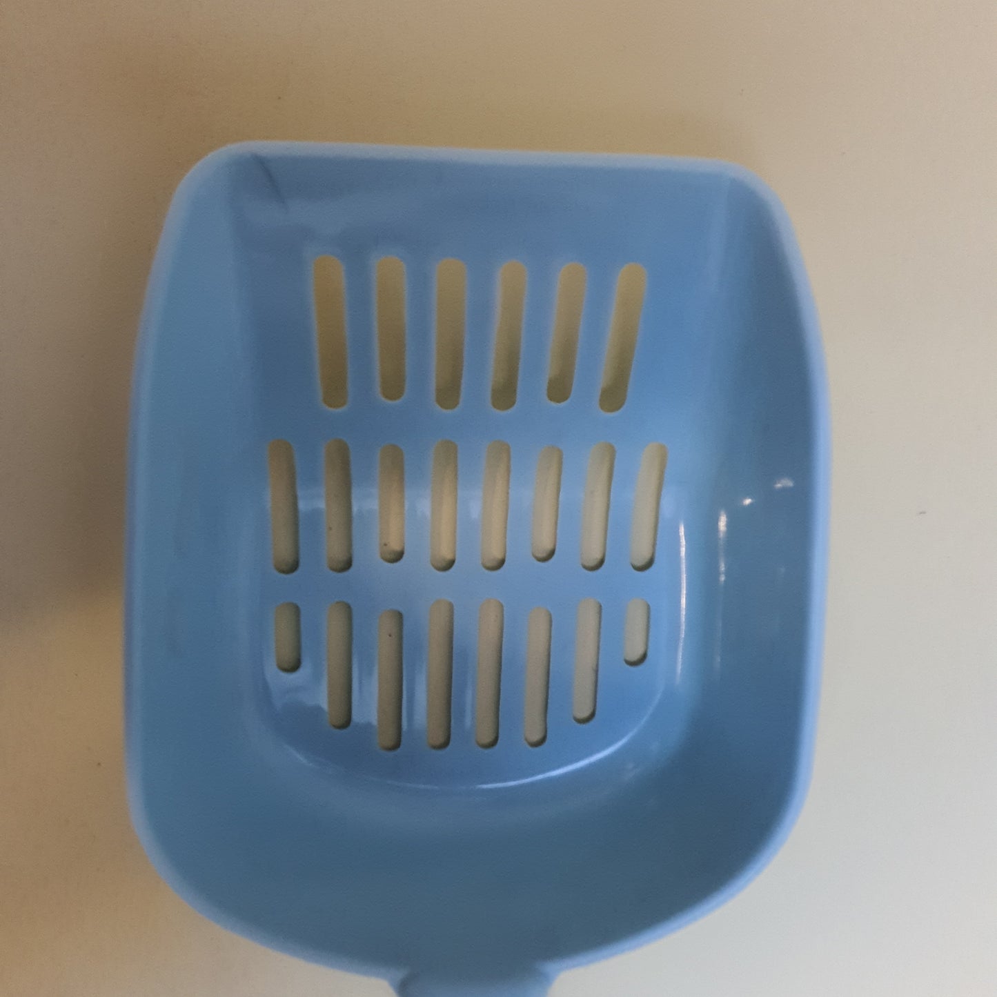 Pala para arena de gato