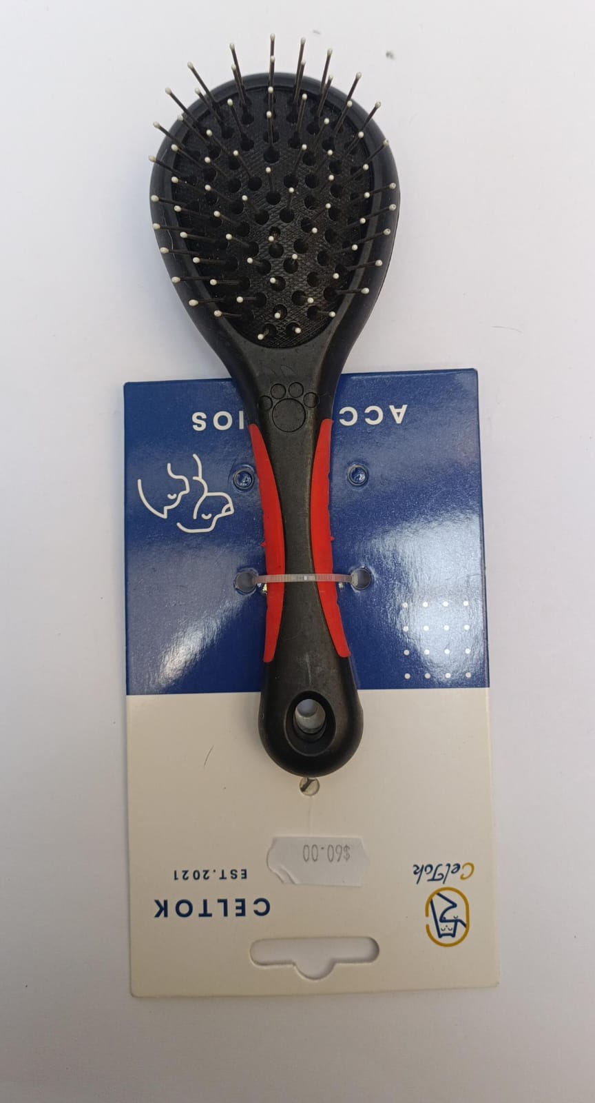 Cepillo para perro de pelo largo de doble cerda.
